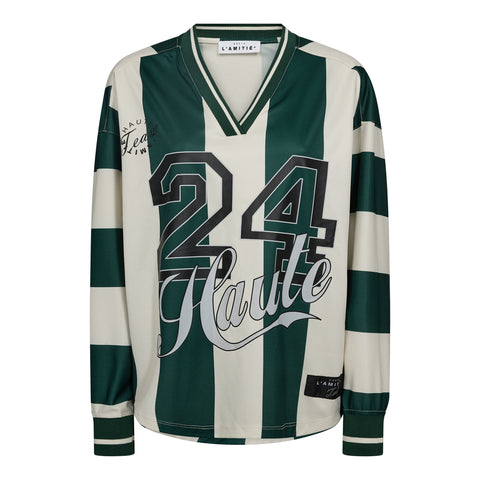 Haute L'amitié Haute 24 Stribet bluse&nbsp;er en moderne og iøjnefaldende bluse, der kombinerer sporty æstetik med et feminint udtryk. Blusen er designet med brede striber i grøn og perlehvid, hvilket giver et friskt og energisk look, der skiller sig ud i hverdagsgarderoben. Den lange ærmelængde og lige pasform sikrer komfort og bevægelsesfrihed, mens den klassiske halsudskæring og medium toplængde gør den nem at style med både jeans, nederdele og sporty accessories.