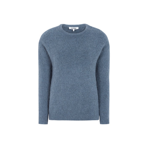 SRCamilla Knit fra Soft Rebels er en luksuriøs og alsidig striktrøje, der forener komfort med et stilrent udtryk. Den melerede grå farve Grisaille Melange tilfører et sofistikeret touch, som gør trøjen nem at style til både hverdag og mere elegante lejligheder.